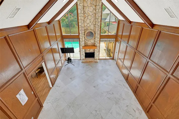 a view of a livingroom with furniture wooden floor and windows