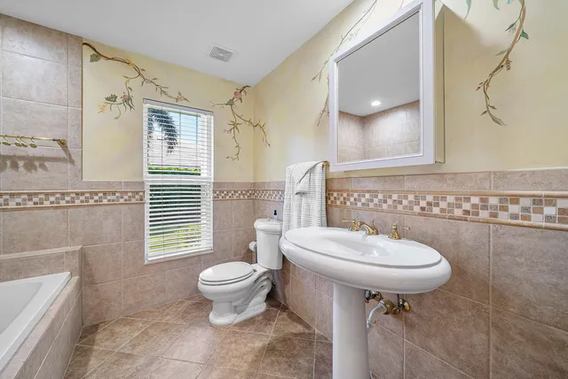 a view of a house with a yard and a garden