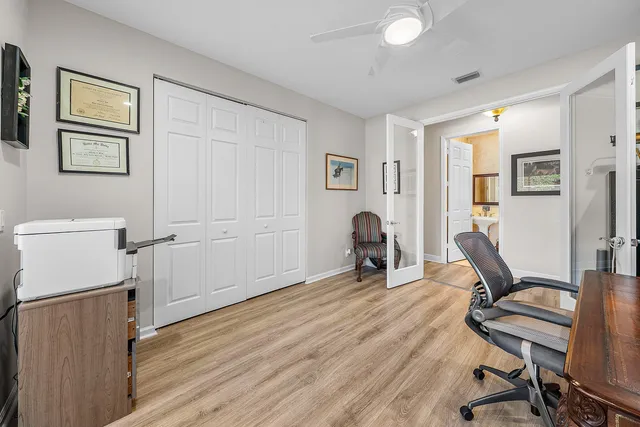 a view of a yard with plants and trees