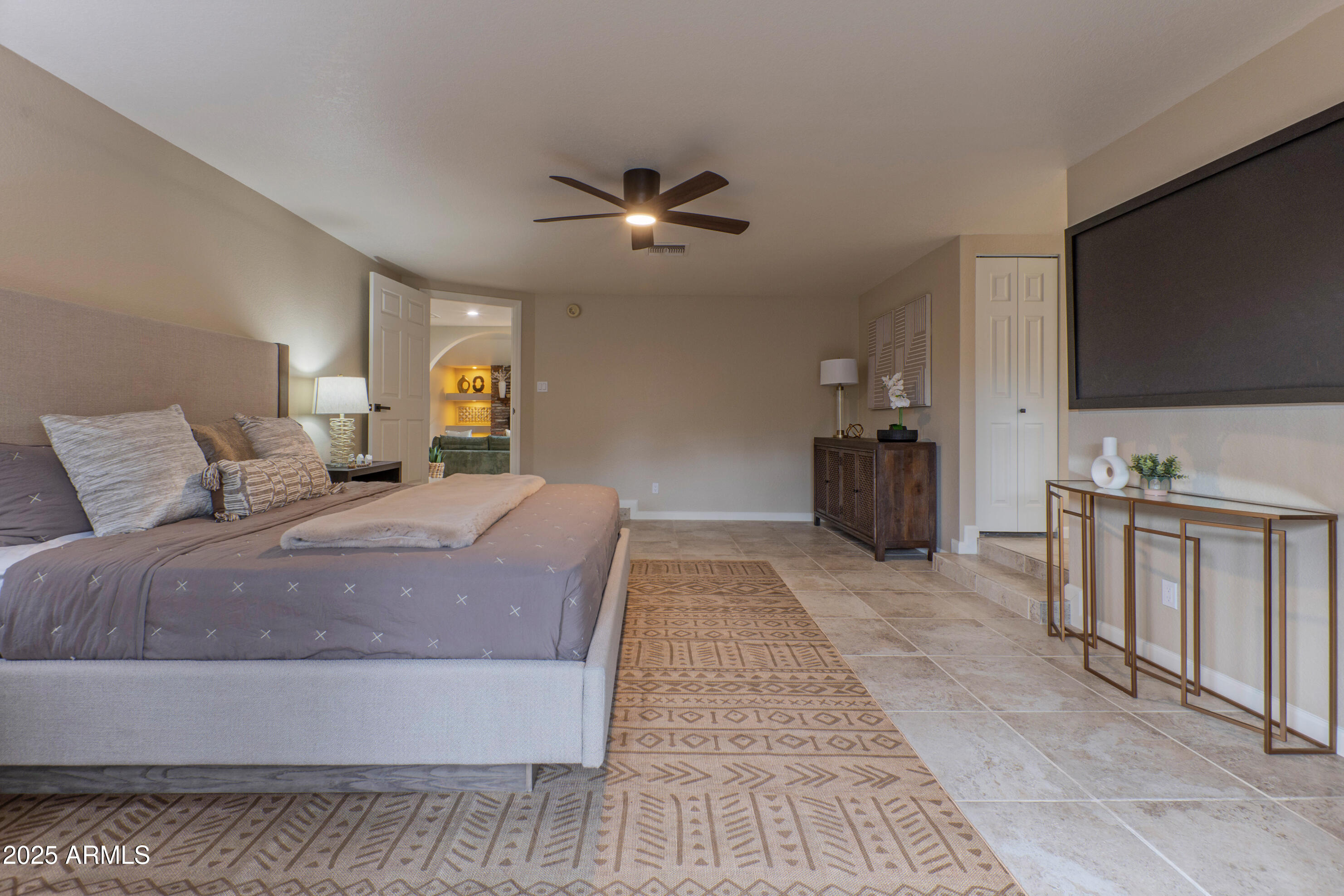 5911 East Peak View Road Cave Creek, AZ 85331 - Photo 24 of 63 a living room with furniture and a flat screen tv