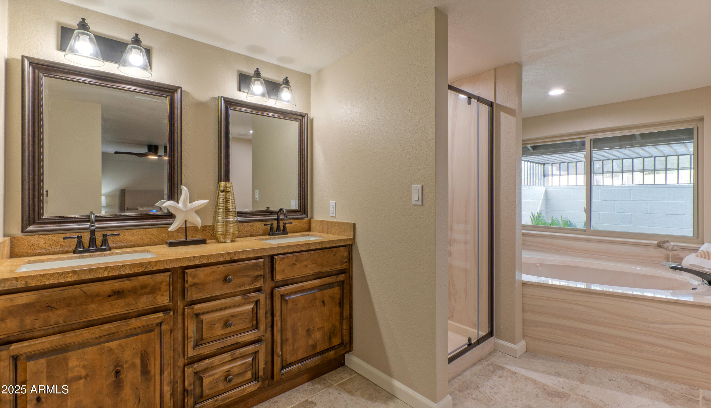 5911 East Peak View Road Cave Creek, AZ 85331 - Photo 27 of 63 a bathroom with double vanity sinks and a mirror