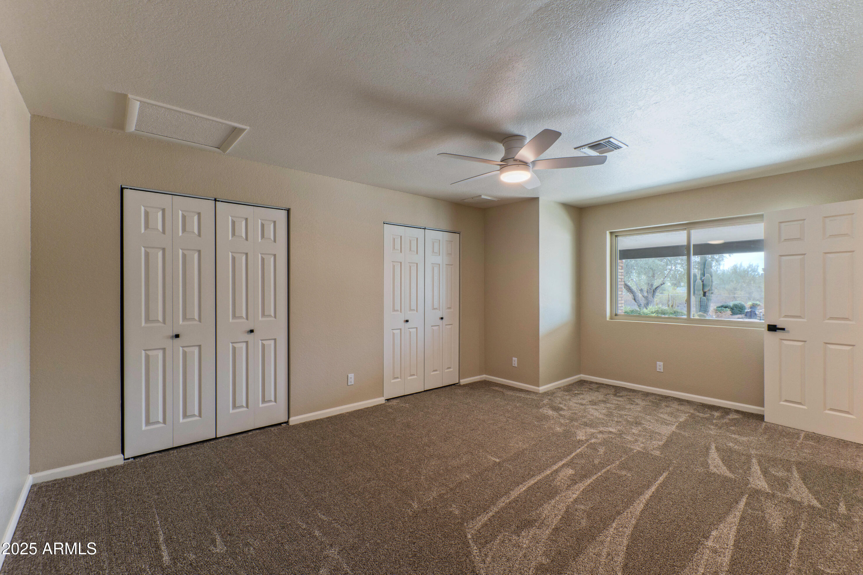 5911 East Peak View Road Cave Creek, AZ 85331 - Photo 30 of 63 a view of an empty room with a window