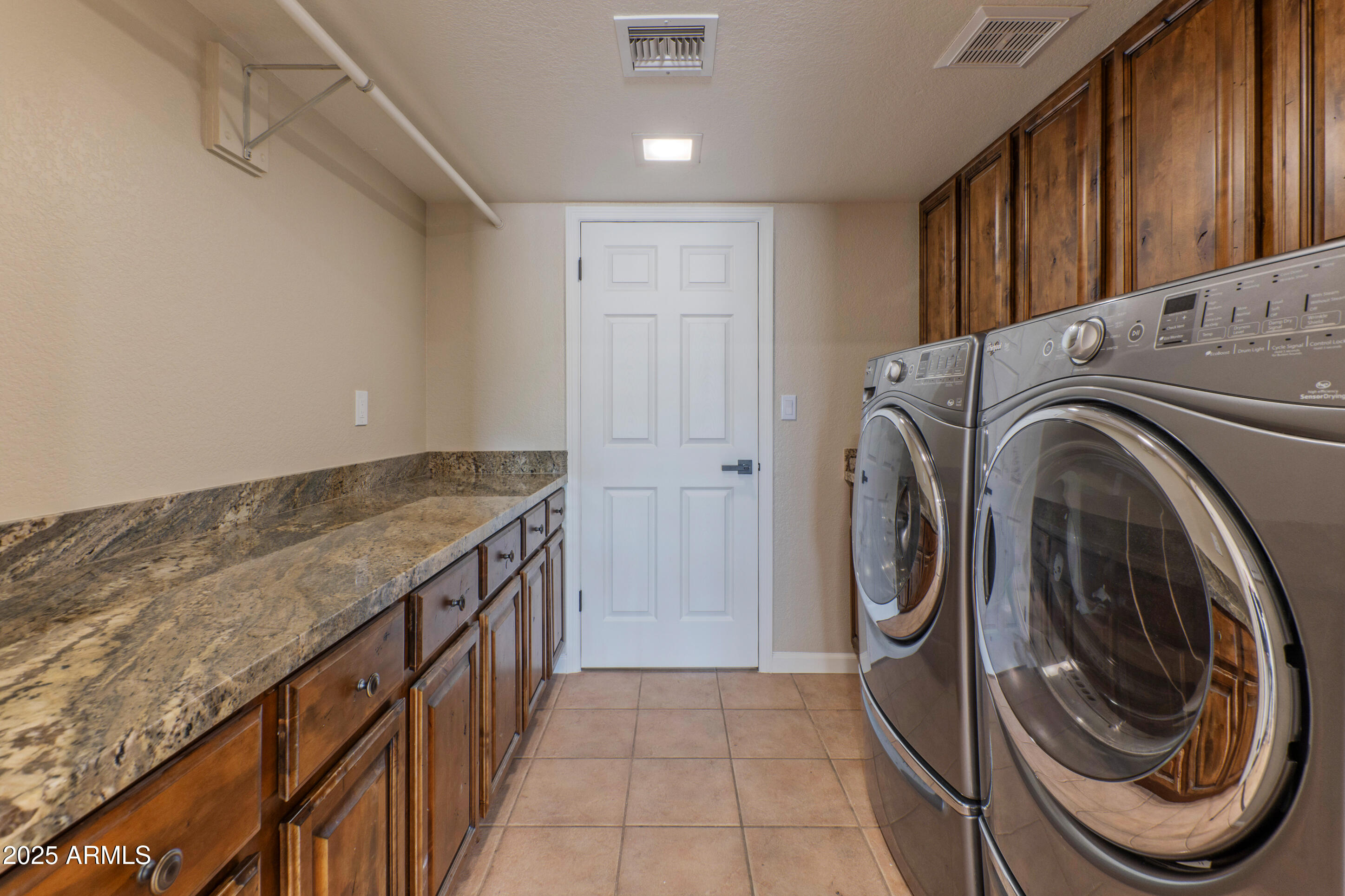 5911 East Peak View Road Cave Creek, AZ 85331 - Photo 37 of 63 a view of a kitchen with washer and dryer