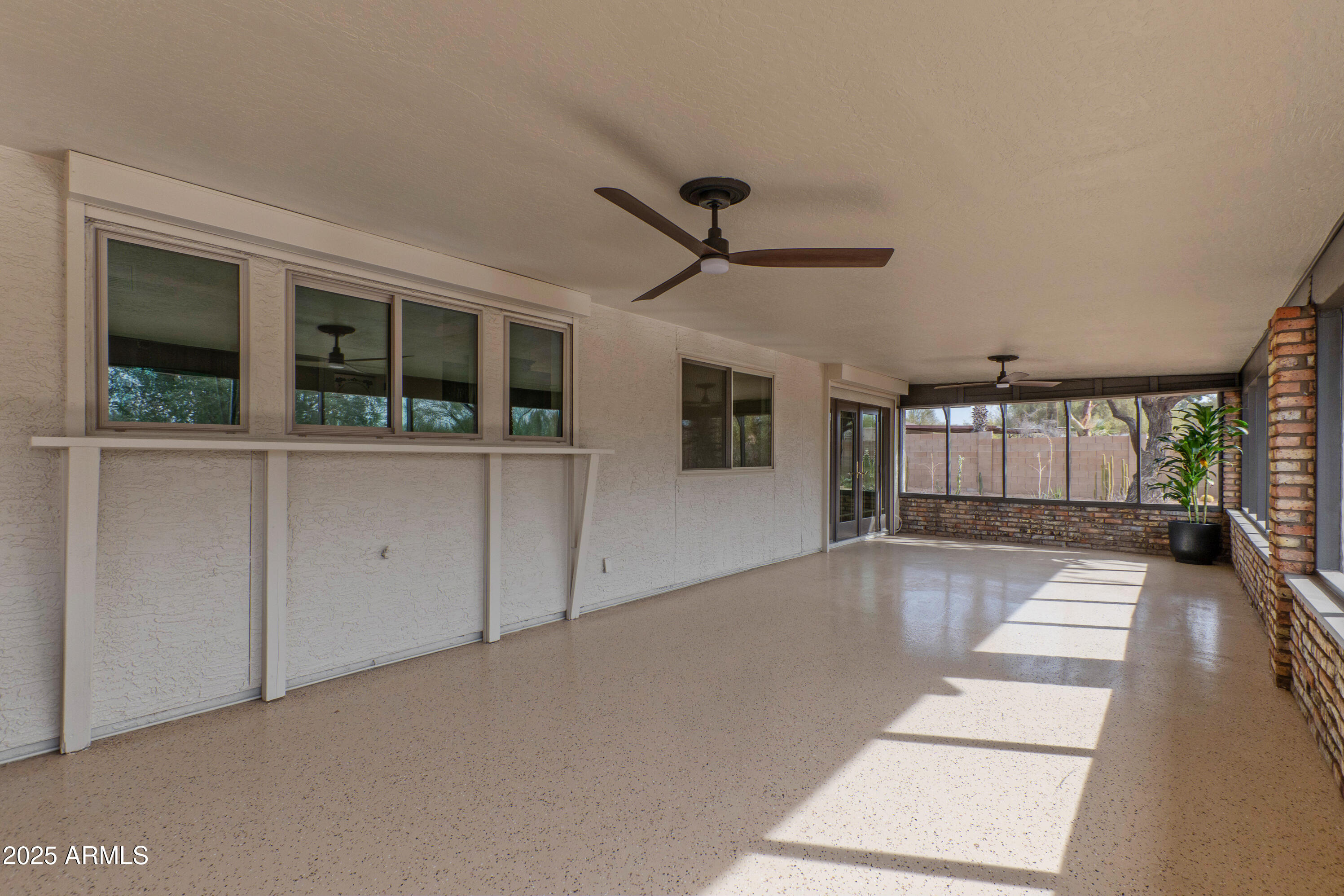5911 East Peak View Road Cave Creek, AZ 85331 - Photo 39 of 63 a view of a living room with a large window