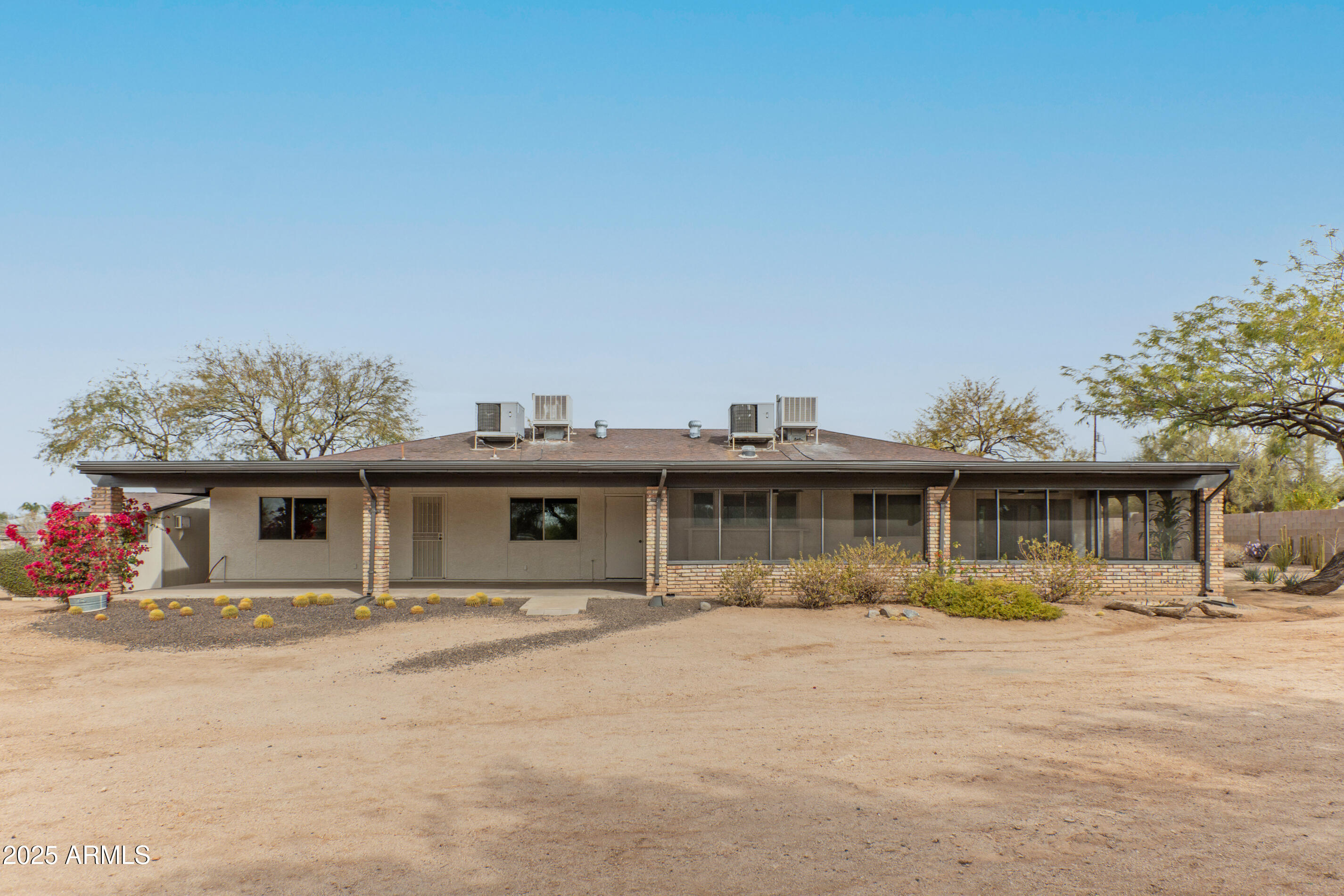 5911 East Peak View Road Cave Creek, AZ 85331 - Photo 43 of 63 a front view of a house with a yard