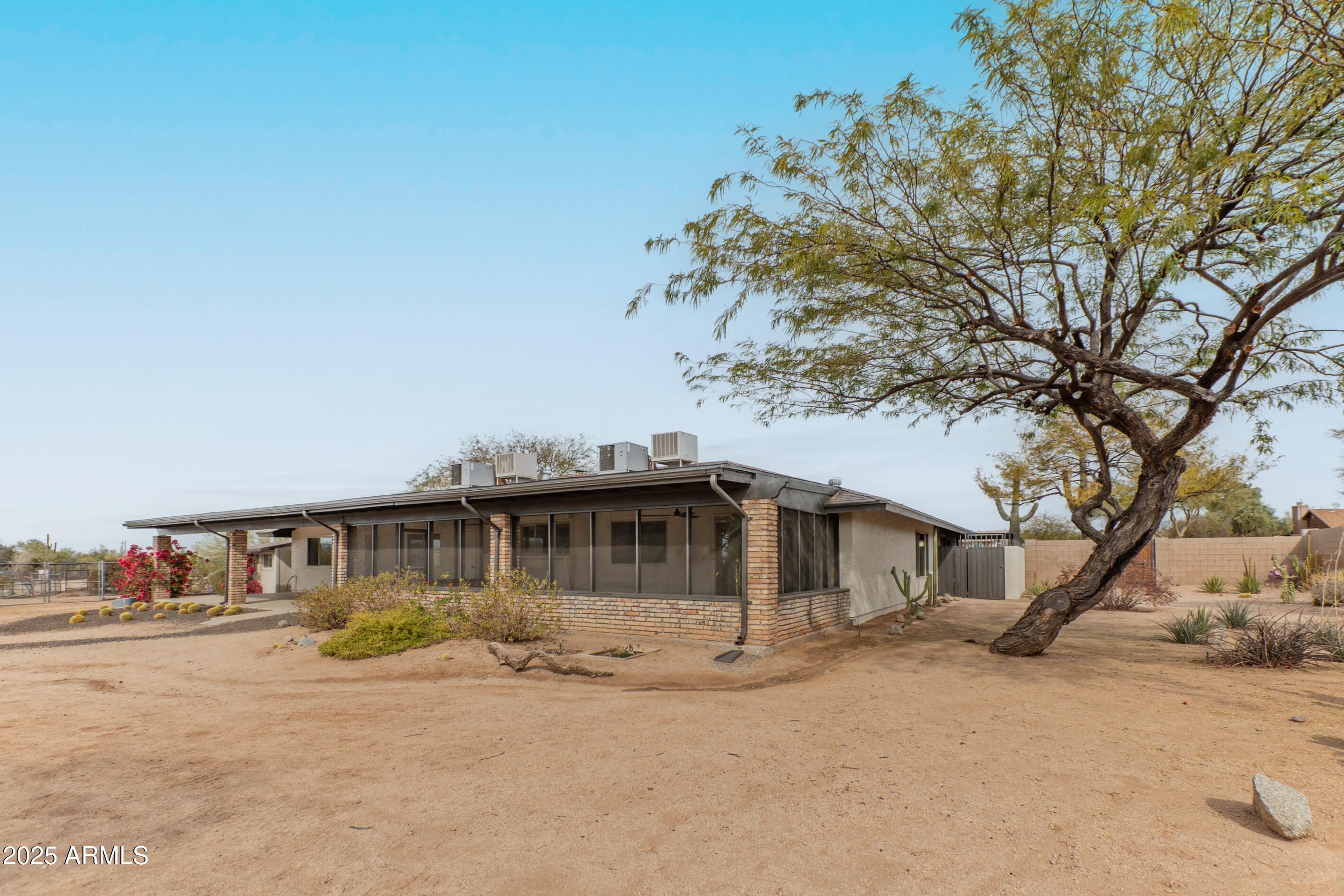 5911 East Peak View Road Cave Creek, AZ 85331 - Photo 45 of 63 a front view of a house with a yard