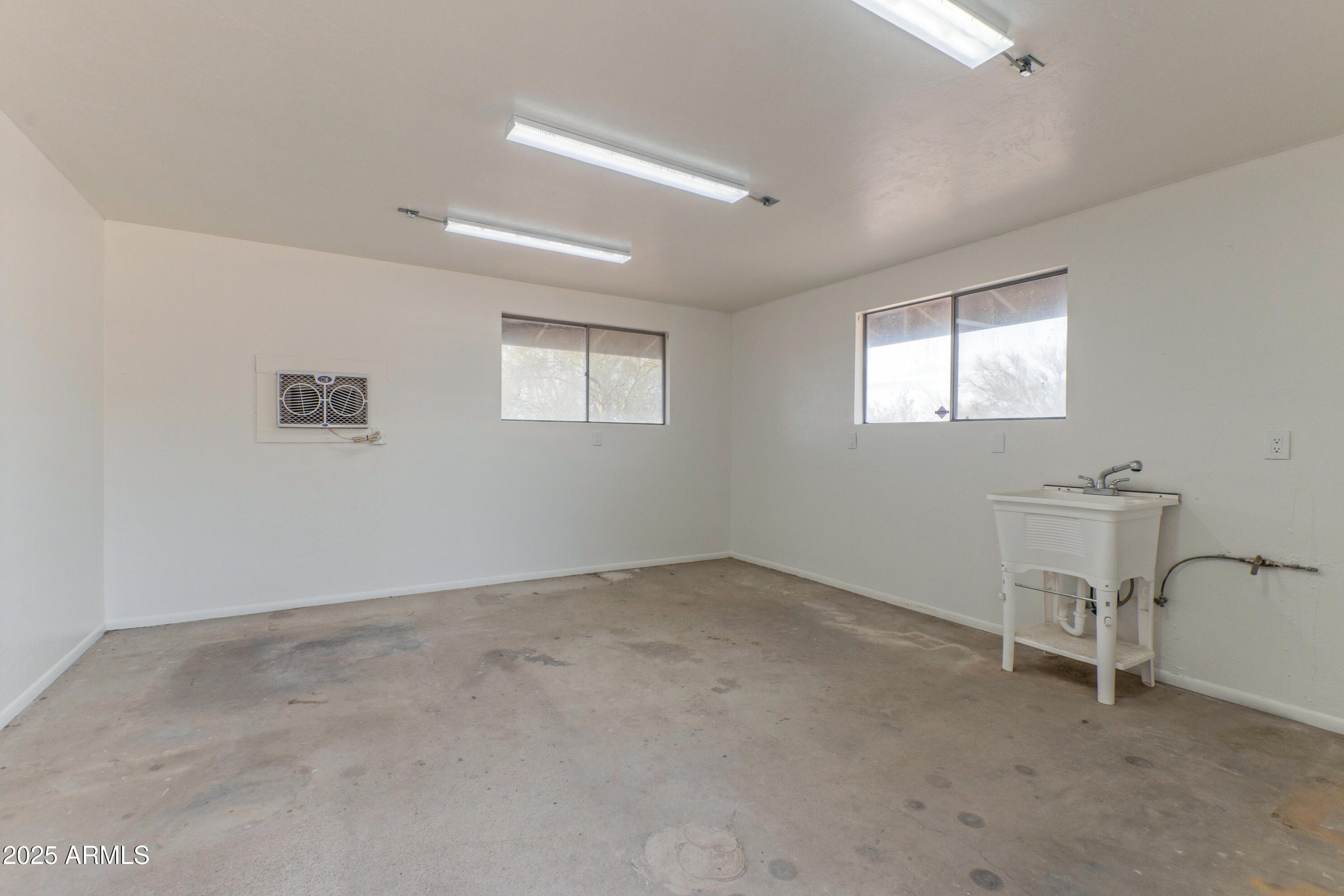 5911 East Peak View Road Cave Creek, AZ 85331 - Photo 47 of 63 a view of an empty room with a window