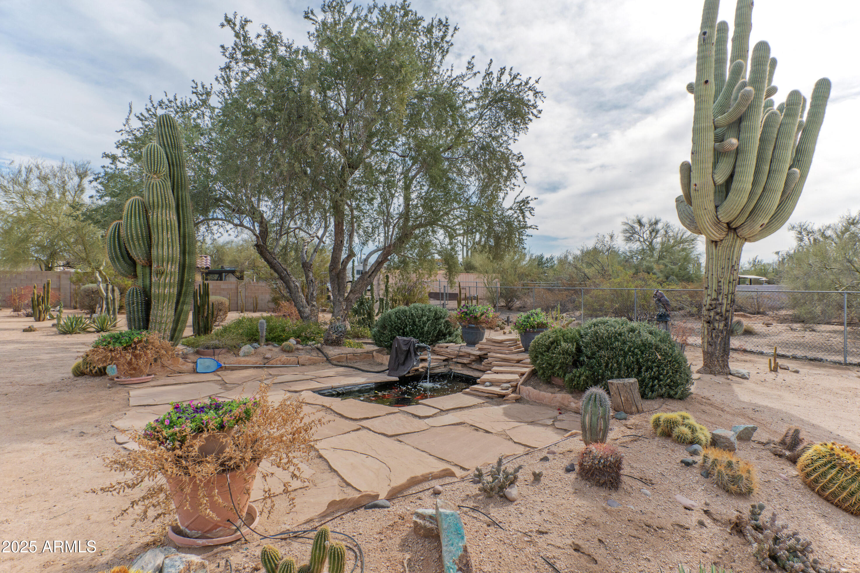 5911 East Peak View Road Cave Creek, AZ 85331 - Photo 52 of 63 a view of a backyard with sitting area