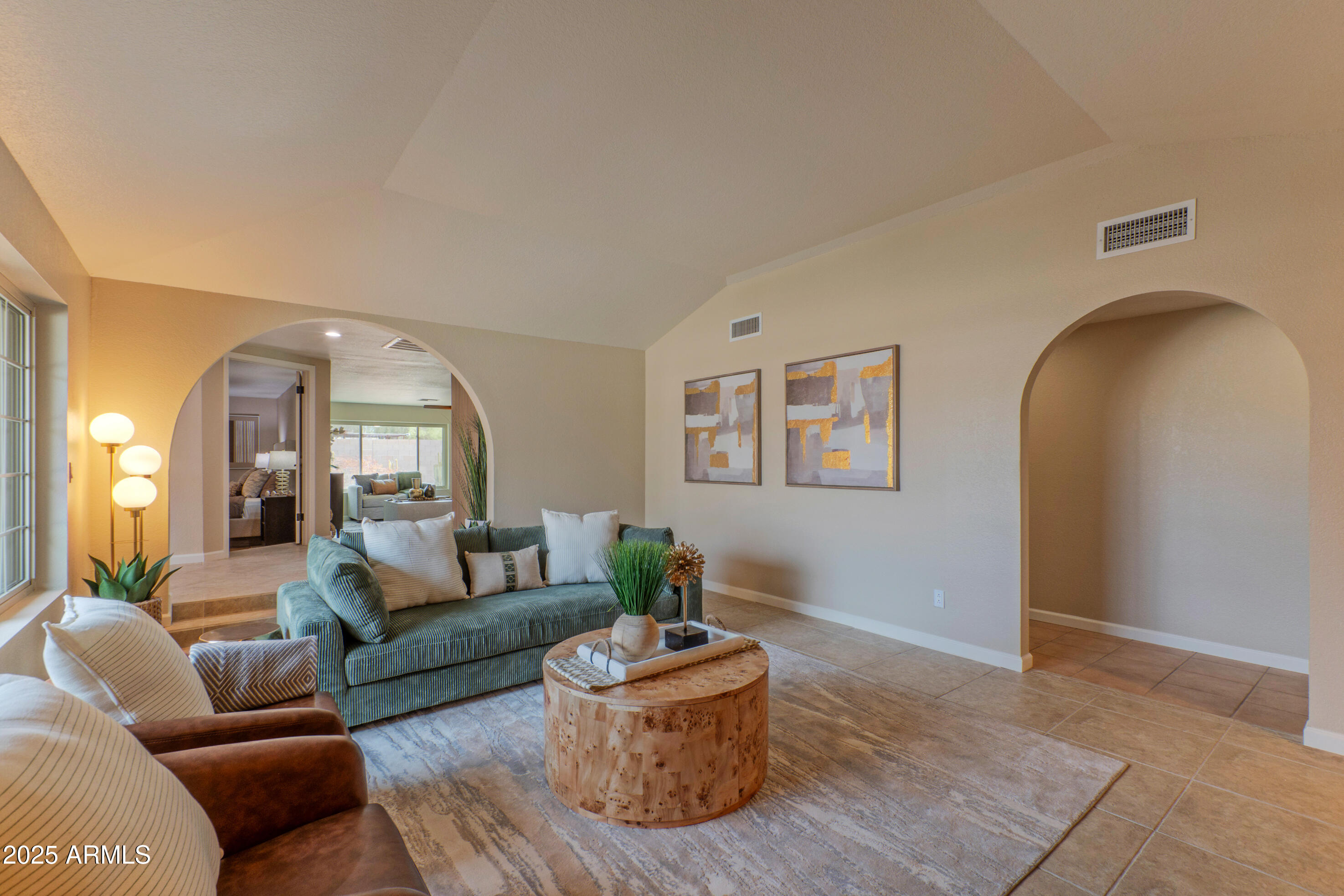 5911 East Peak View Road Cave Creek, AZ 85331 - Photo 10 of 63 a living room with furniture and a potted plant