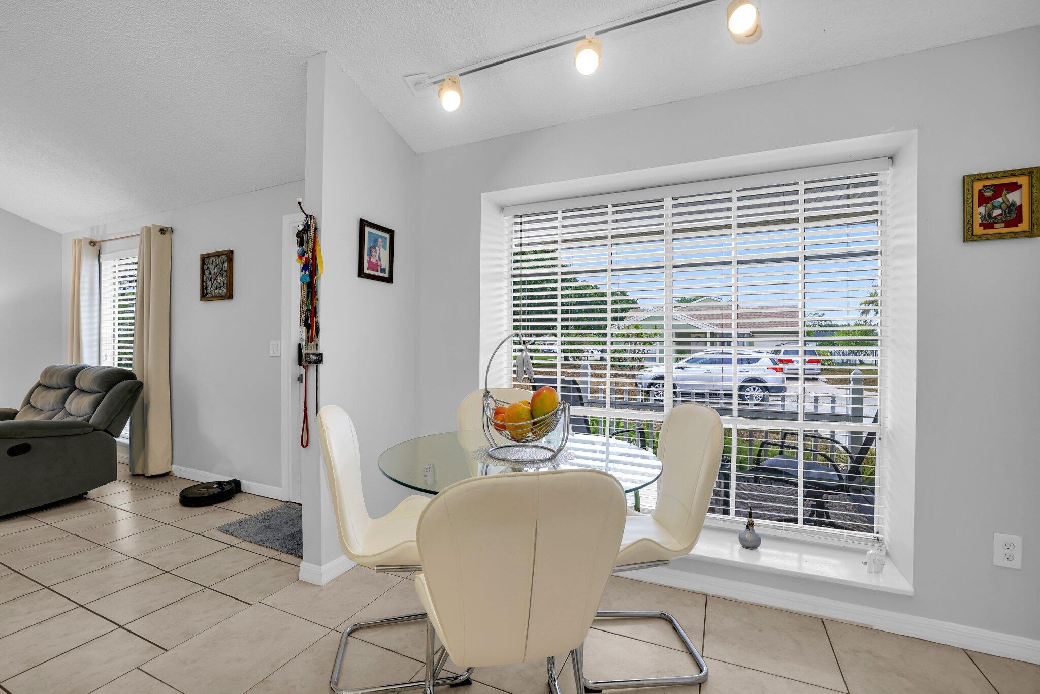 8269 Huntsman Place Boca Raton, FL 33433 - Photo 8 of 42 a view of a livingroom with furniture and windows