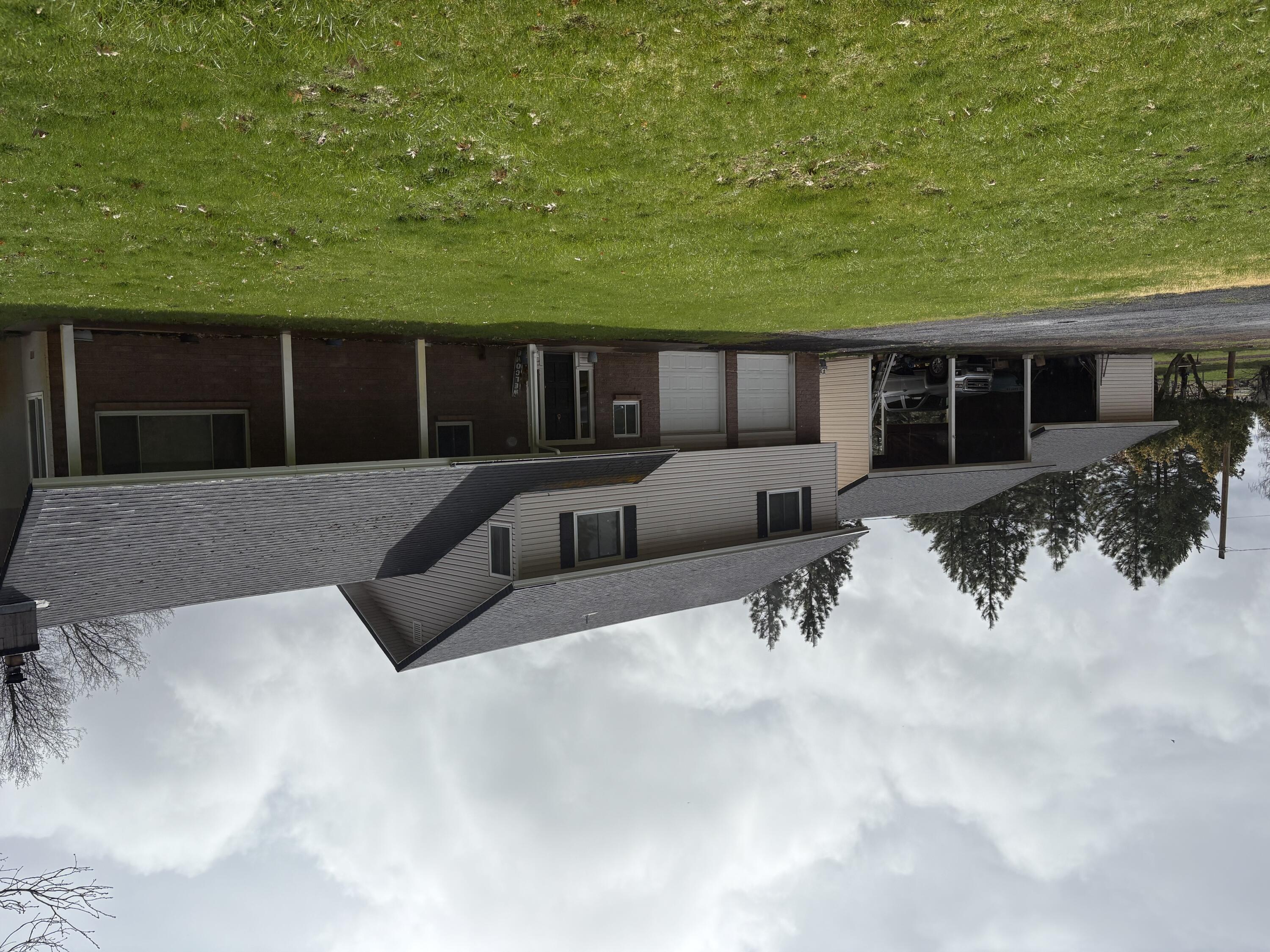41139 Brown Road Fall River Mills, CA 96028 - Photo 1 of 29 a view of a house with a yard and large trees