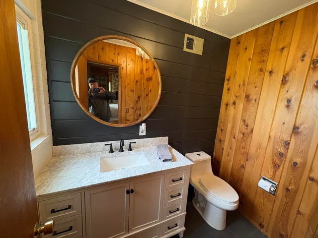 a bathroom with a sink and a mirror