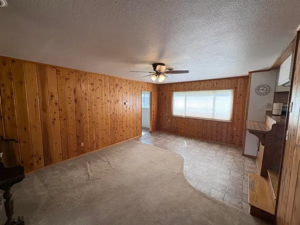 a view of livingroom with hardwood floor and hallway