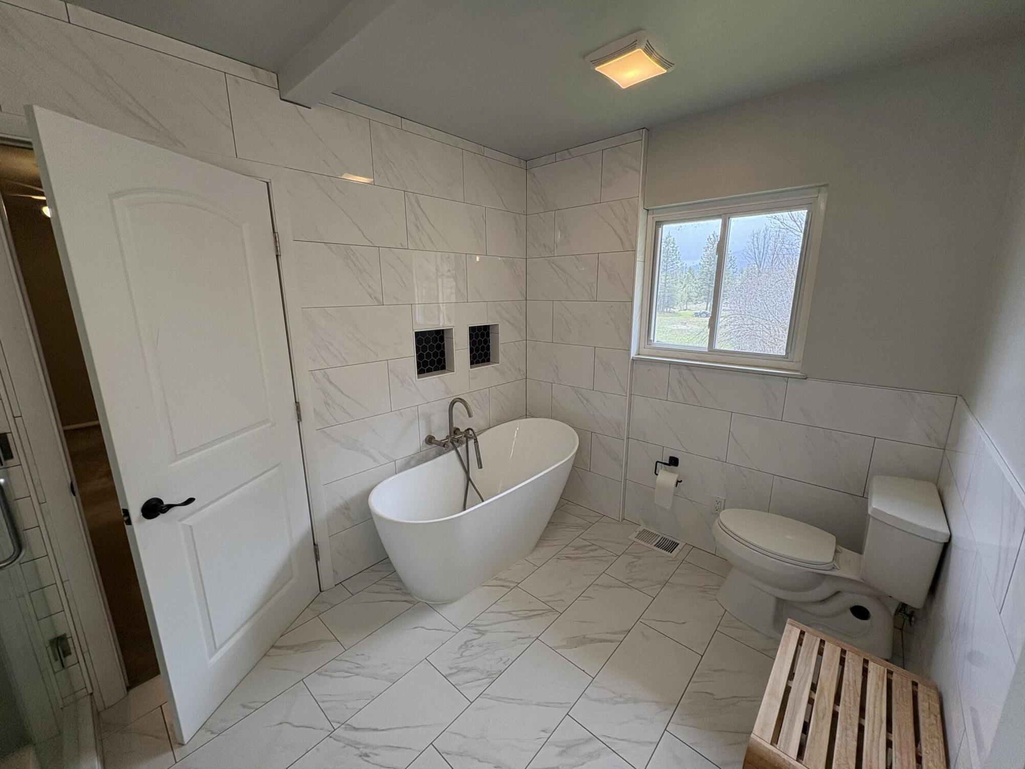 41139 Brown Road Fall River Mills, CA 96028 - Photo 22 of 29 a spacious bathroom with a bathtub and toilet