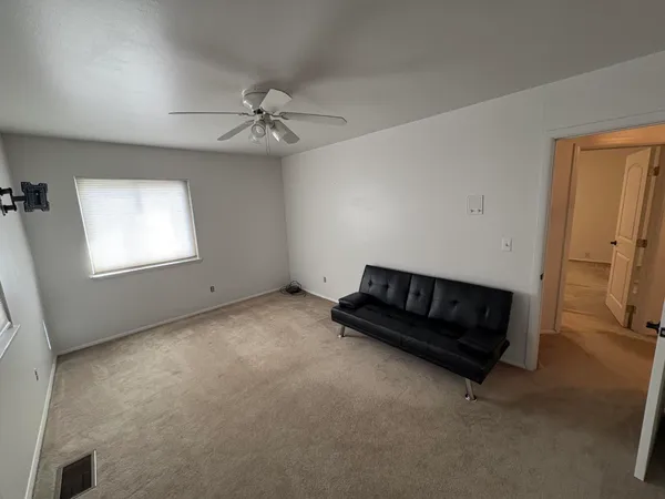 a living room with furniture and a window