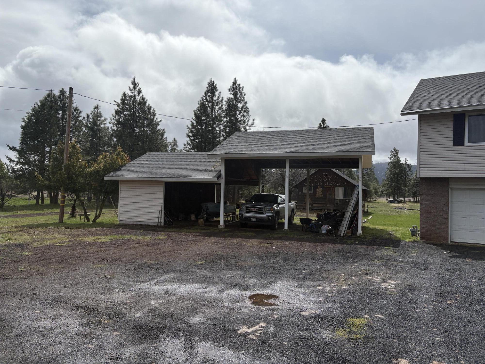 41139 Brown Road Fall River Mills, CA 96028 - Photo 3 of 29 a view of a car park in front of house