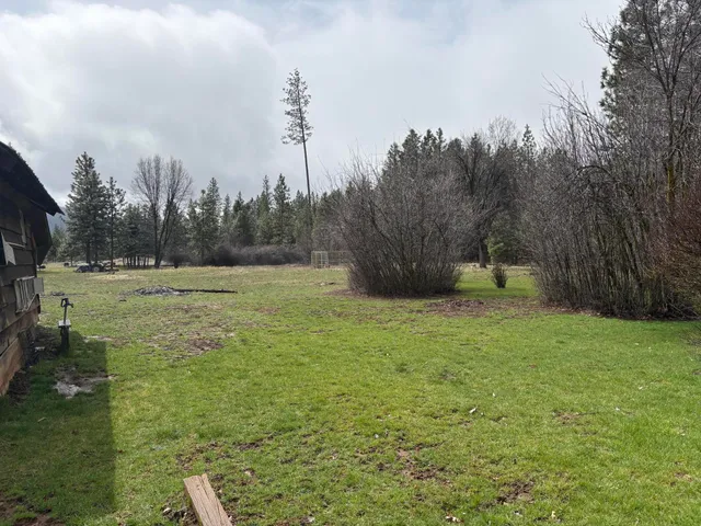 a view of outdoor space with deck and yard