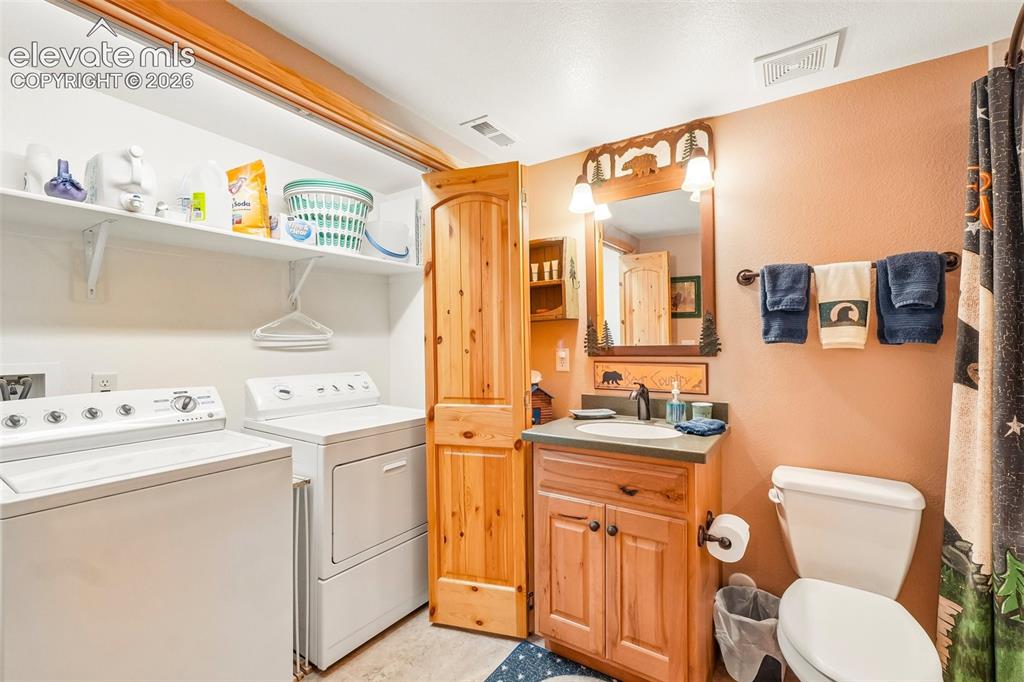 858 Oak Ridge Road Manitou Springs, CO 80829 - Photo 42 of 50 Full bathroom with laundry near bedroom 3 on lower level