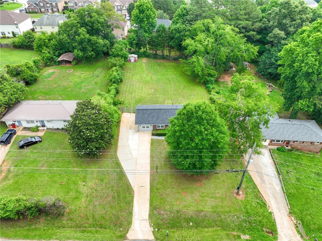 1745 Rockbridge Road Northwest Conyers, GA 30012 - Photo 30 of 32 a view of a lake with a yard