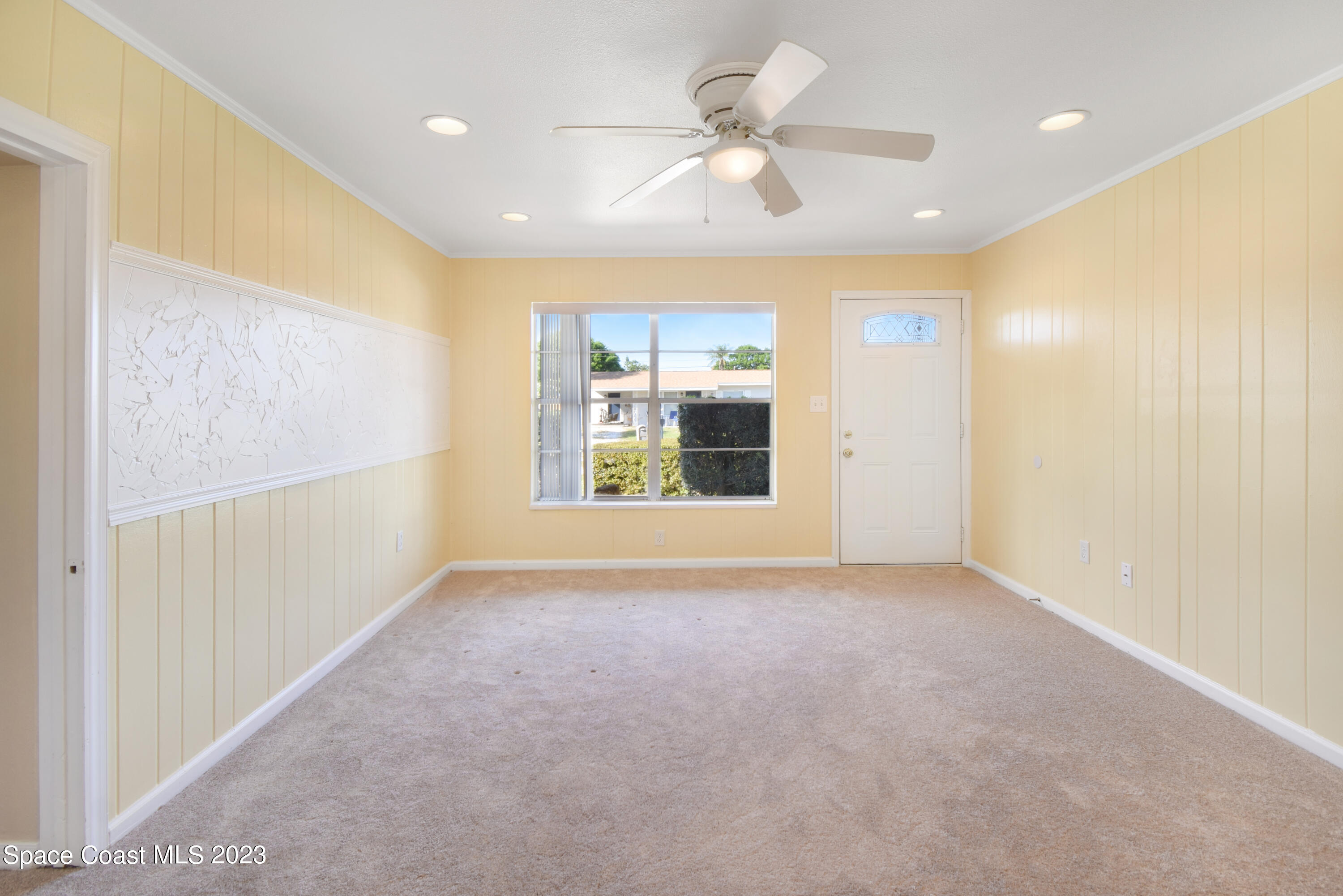 2439 Delaware Drive Melbourne, FL 32935 - Photo 13 of 32 a view of an empty room with a window