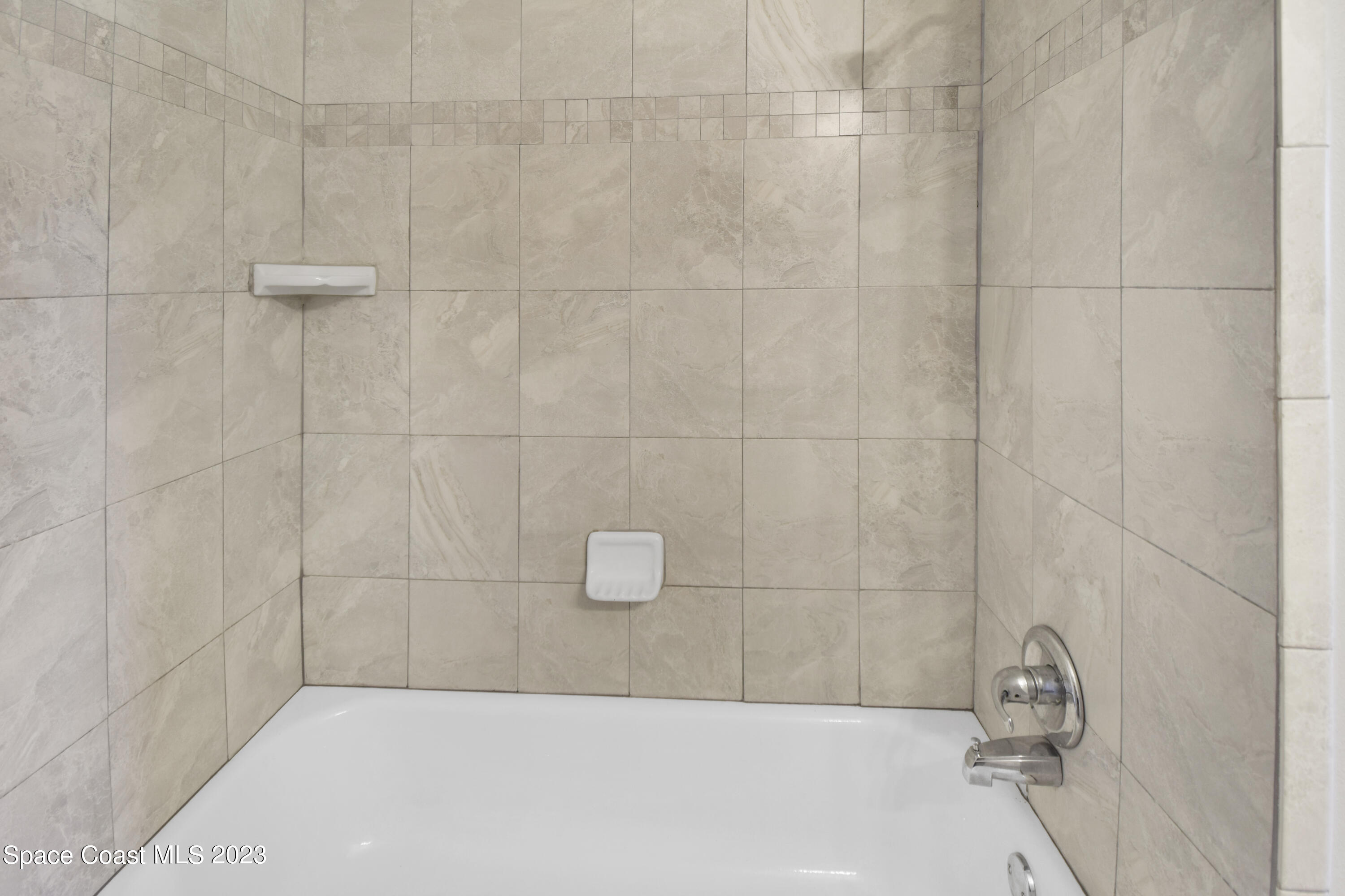 2439 Delaware Drive Melbourne, FL 32935 - Photo 17 of 32 a bathroom with a bathtub