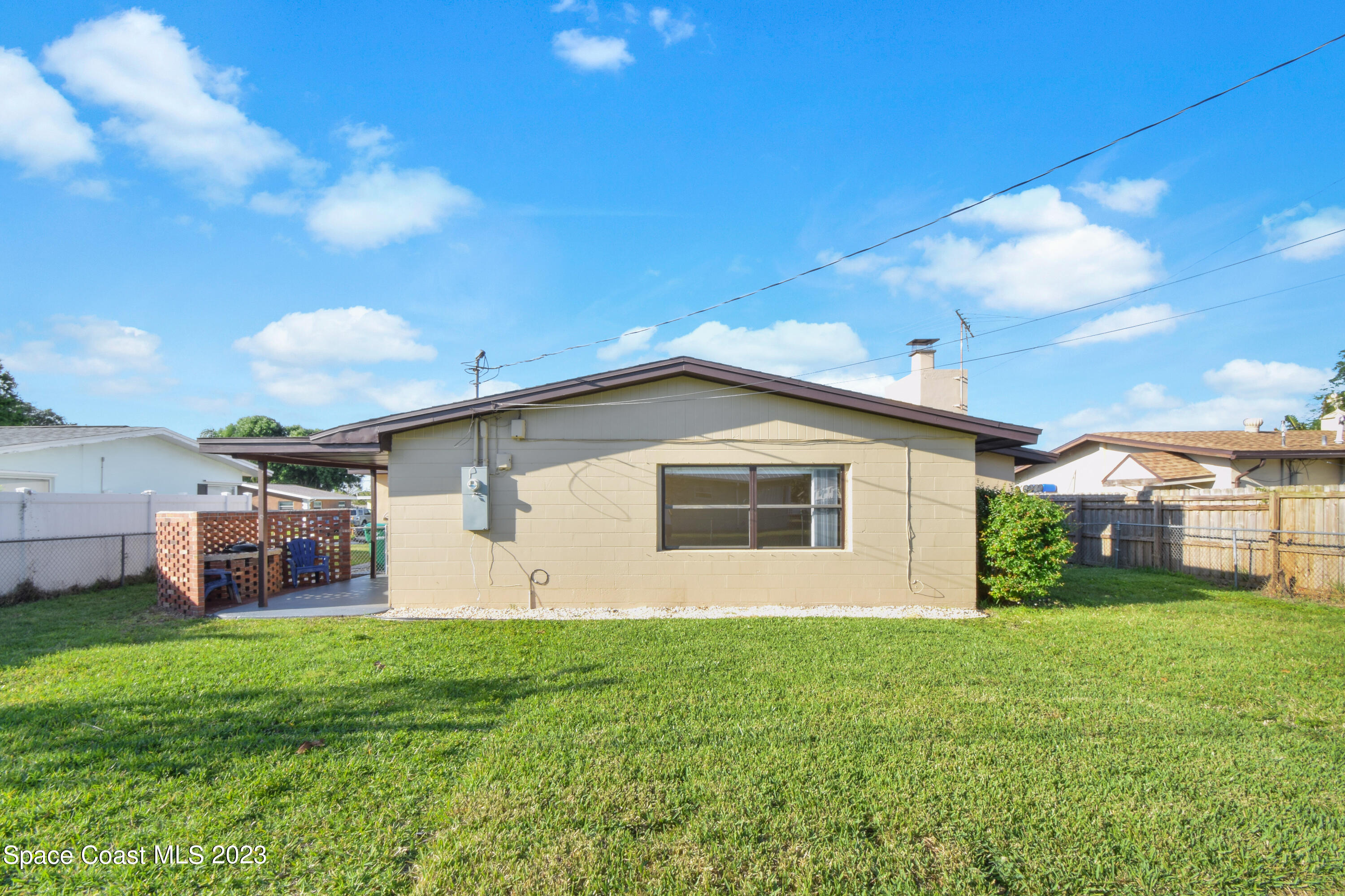2439 Delaware Drive Melbourne, FL 32935 - Photo 26 of 32 a view of a house with yard and sitting area
