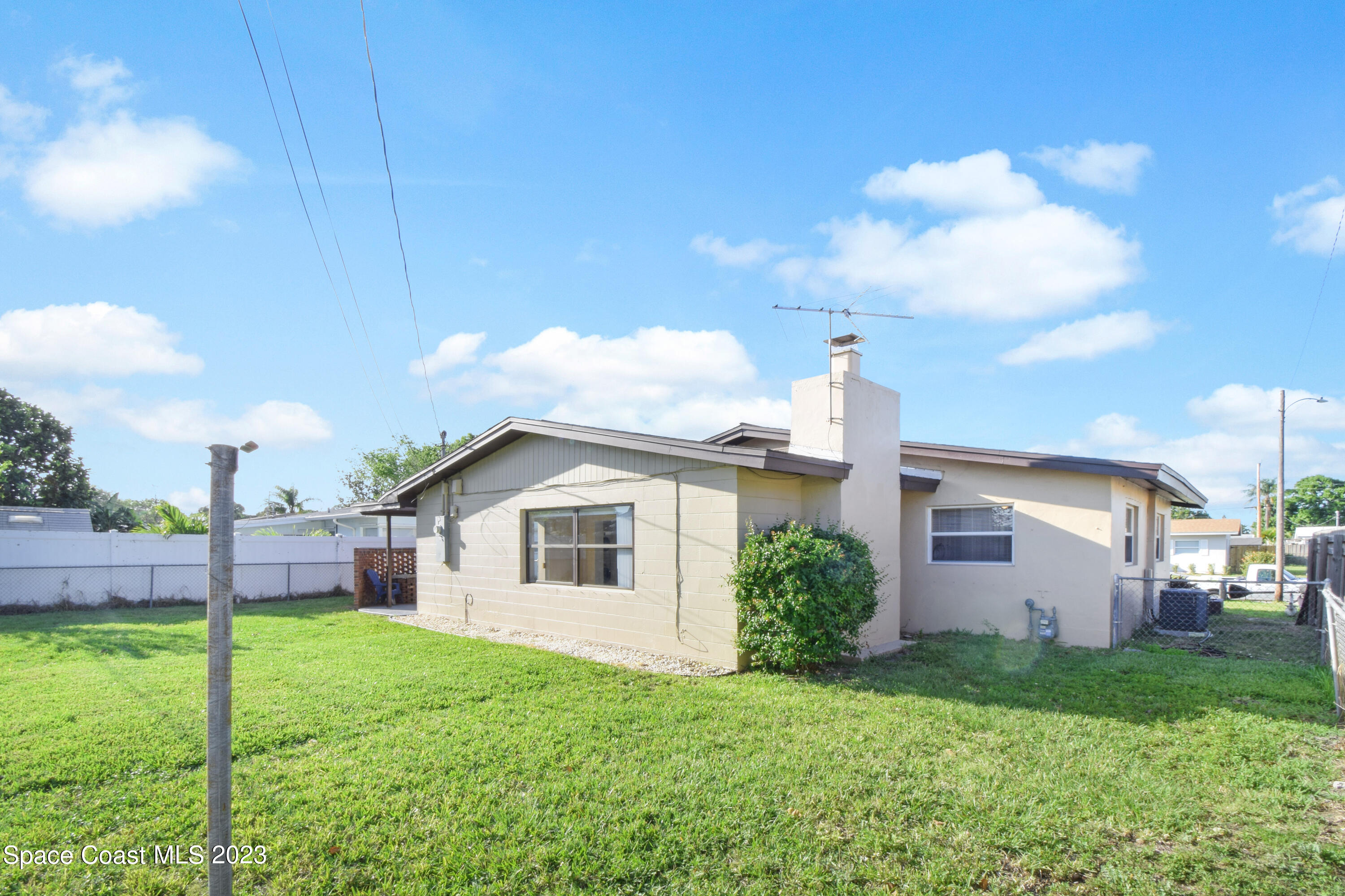 2439 Delaware Drive Melbourne, FL 32935 - Photo 27 of 32 a view of a yard with a house