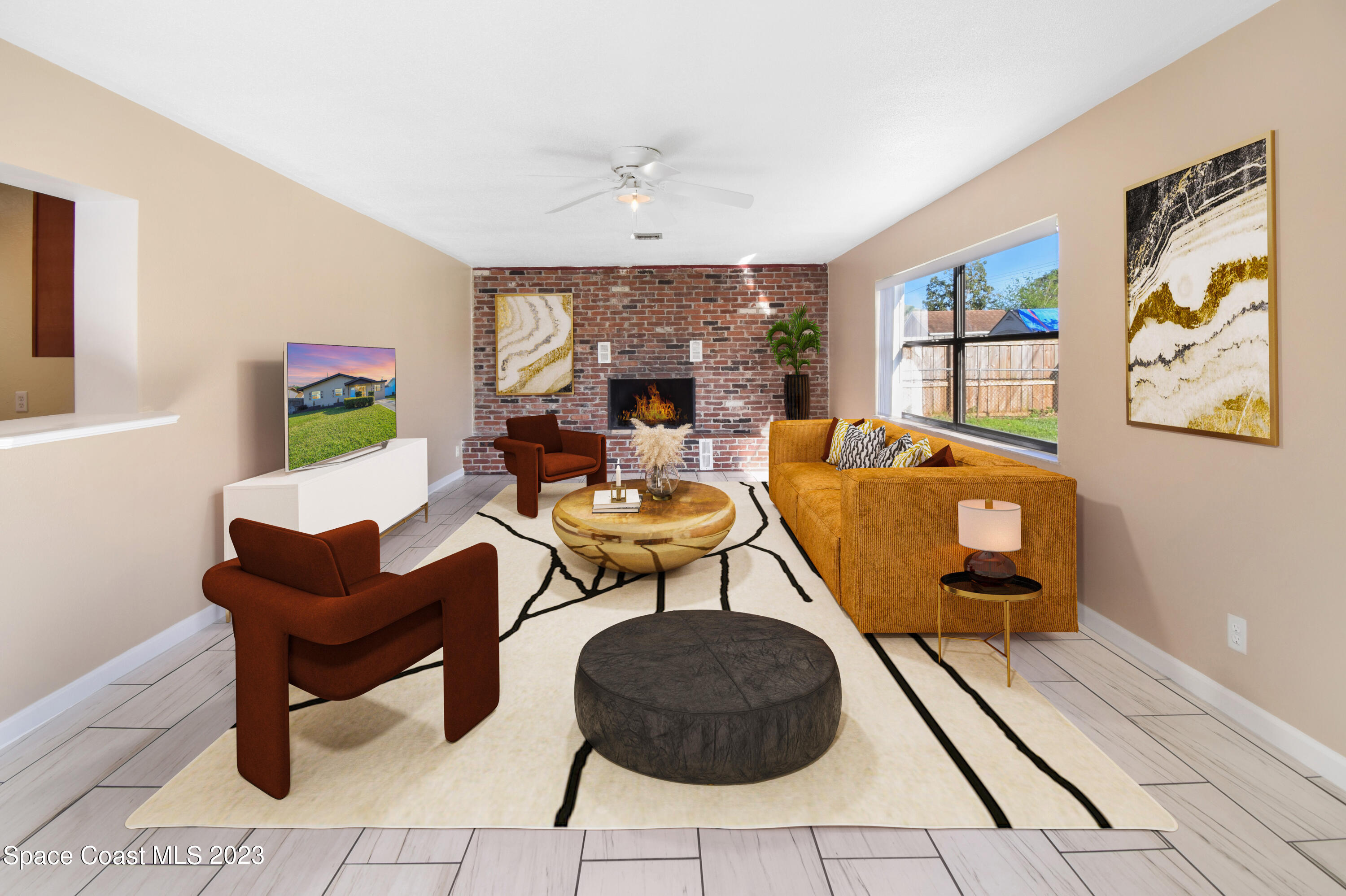 2439 Delaware Drive Melbourne, FL 32935 - Photo 3 of 32 a living room with furniture and a fireplace