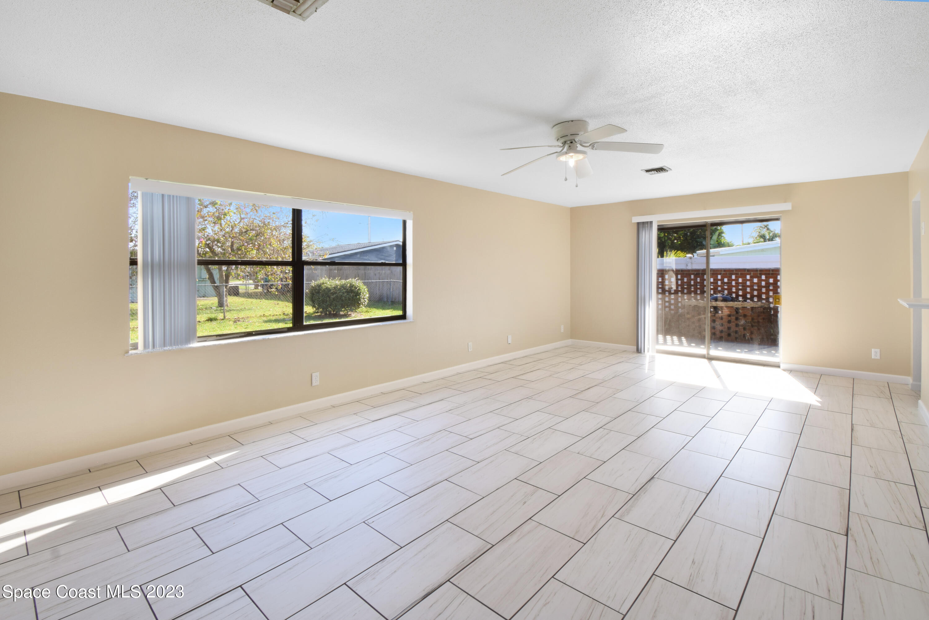 2439 Delaware Drive Melbourne, FL 32935 - Photo 5 of 32 a view of an empty room with a window