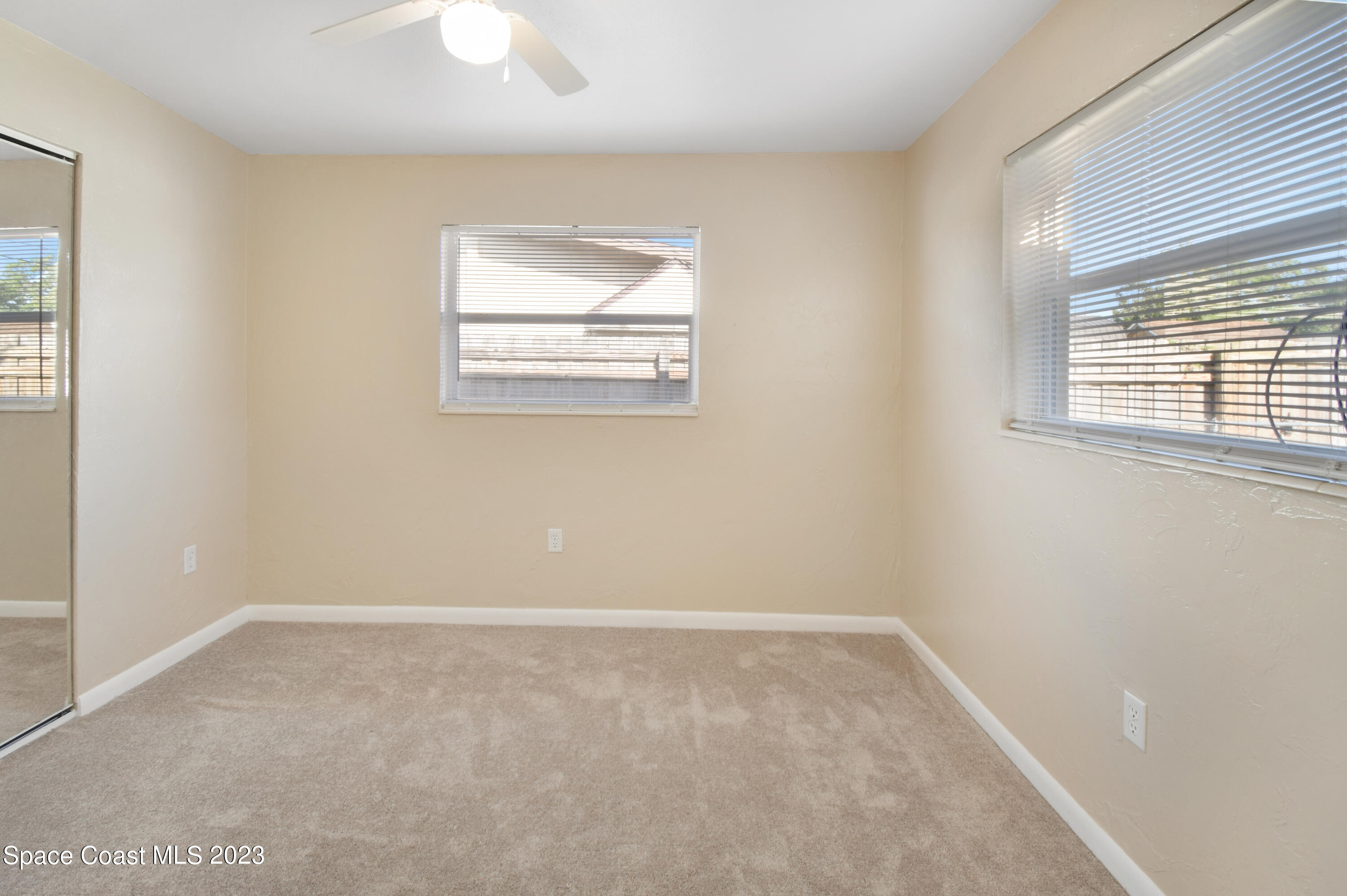 2439 Delaware Drive Melbourne, FL 32935 - Photo 7 of 32 an empty room with a window