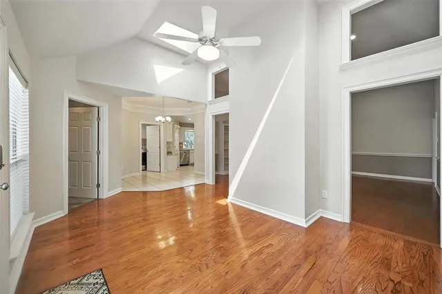 a view of livingroom with hardwood floor and ceiling fan