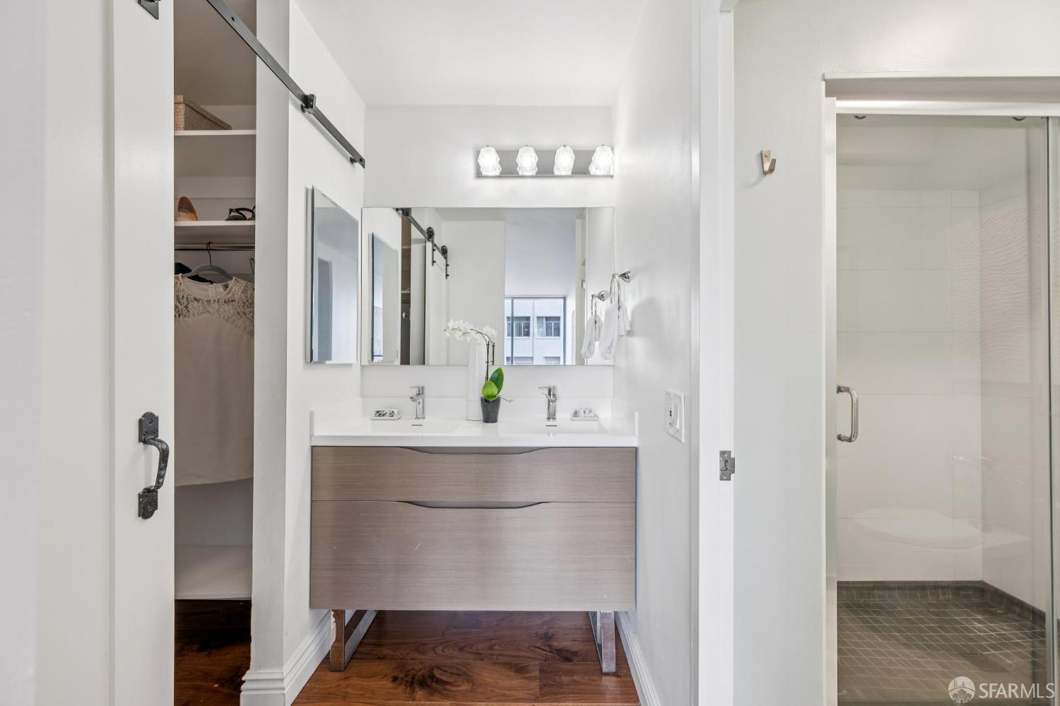 66 Cleary Court, Unit 508 San Francisco, CA 94109 - Photo 15 of 23 a bathroom with a sink and a mirror