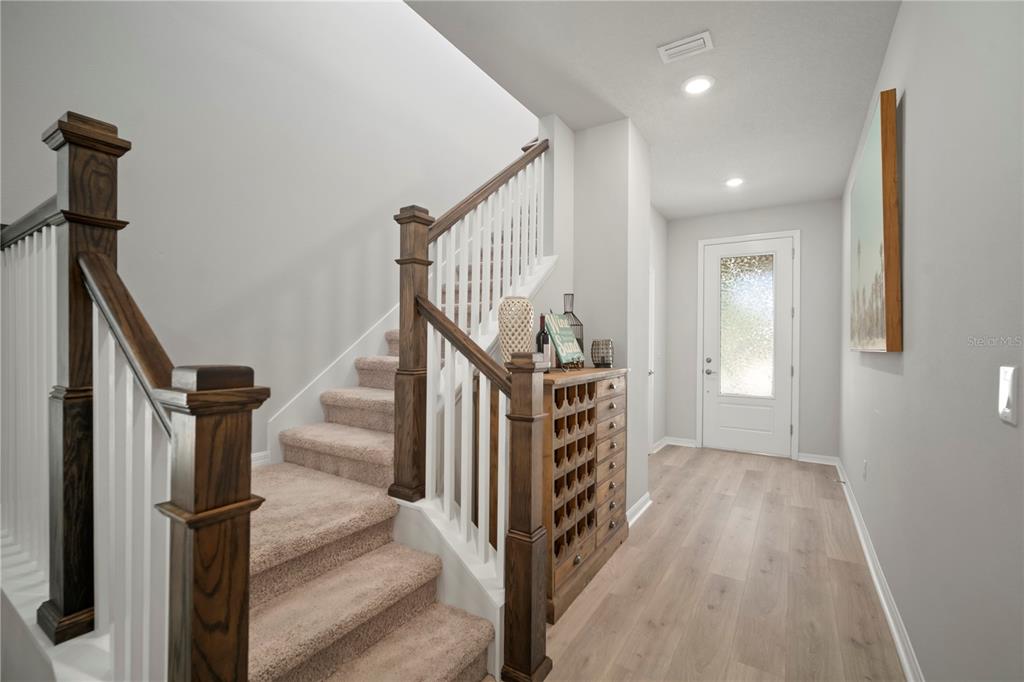 5636 Silver Sun Drive Apollo Beach, FL 33572 - Photo 13 of 61 a view of hallway with stairs and wooden floor