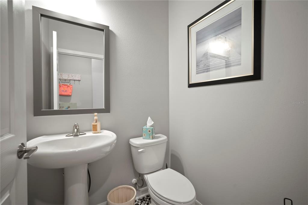 5636 Silver Sun Drive Apollo Beach, FL 33572 - Photo 16 of 61 a bathroom with a toilet a sink and mirror