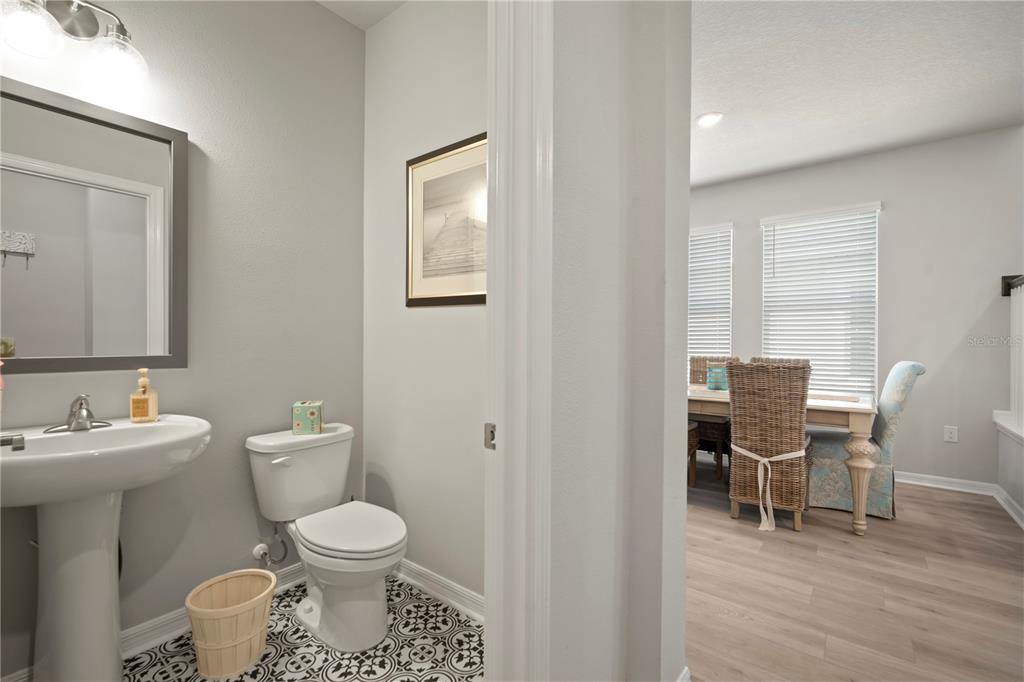 5636 Silver Sun Drive Apollo Beach, FL 33572 - Photo 17 of 61 a bathroom with a toilet a sink and a mirror