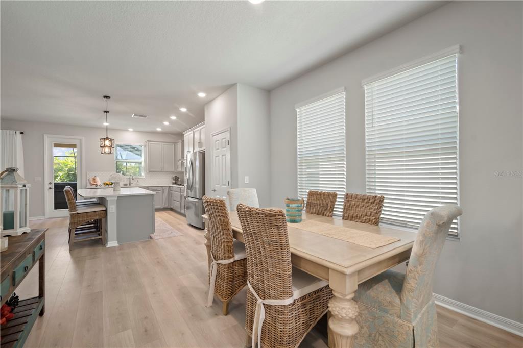 5636 Silver Sun Drive Apollo Beach, FL 33572 - Photo 20 of 61 a dining room with furniture and wooden floor