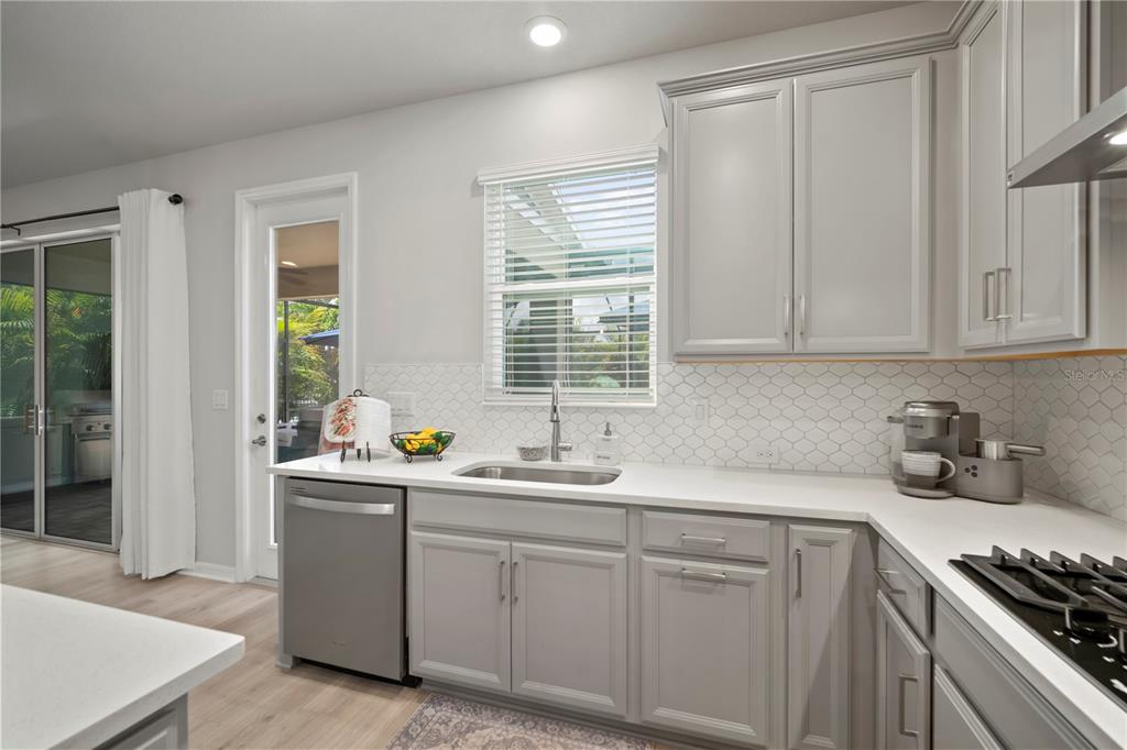 5636 Silver Sun Drive Apollo Beach, FL 33572 - Photo 27 of 61 a kitchen with sink cabinets and window