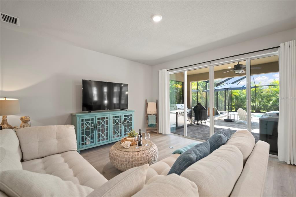 5636 Silver Sun Drive Apollo Beach, FL 33572 - Photo 30 of 61 a living room with furniture and a flat screen tv