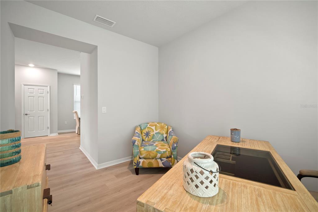 5636 Silver Sun Drive Apollo Beach, FL 33572 - Photo 33 of 61 a bedroom with a bed and a wooden floor