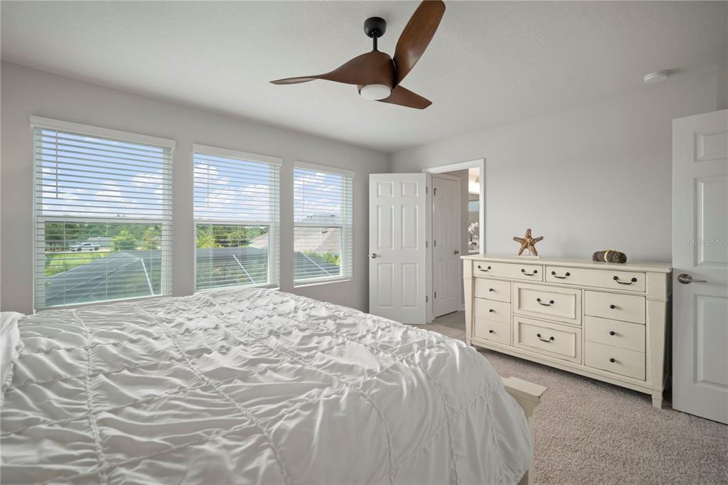 5636 Silver Sun Drive Apollo Beach, FL 33572 - Photo 39 of 61 a bedroom with a large bed and a window
