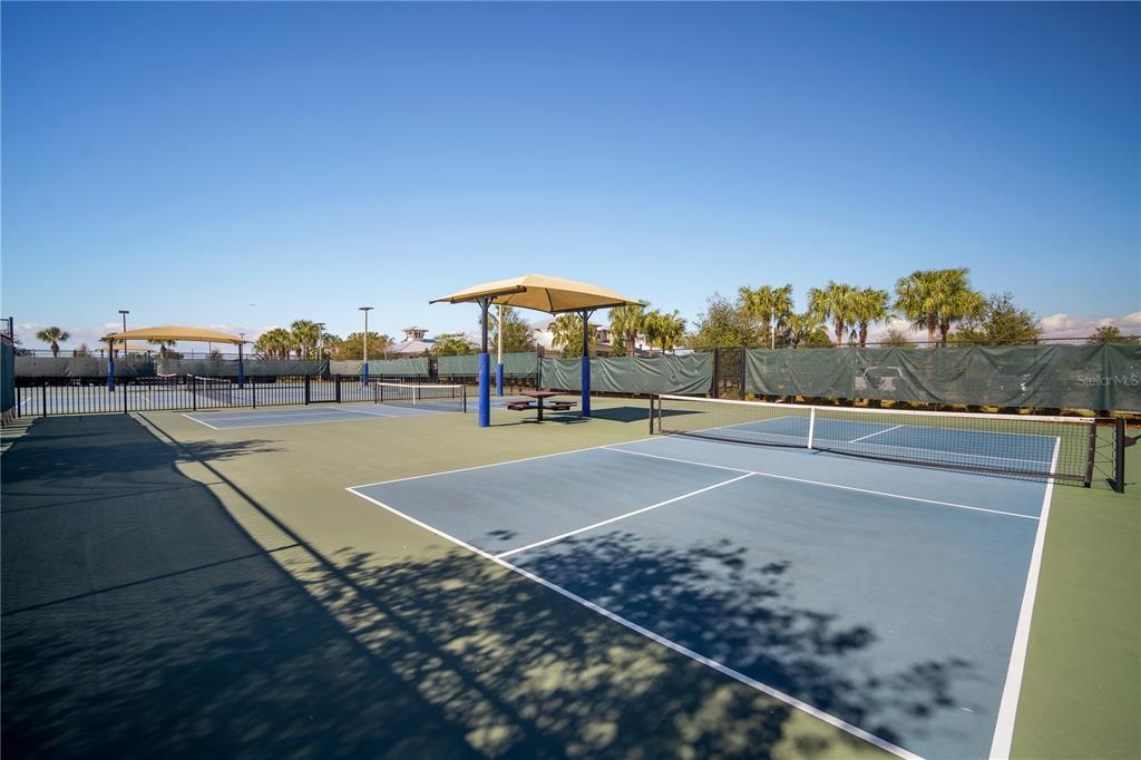 5636 Silver Sun Drive Apollo Beach, FL 33572 - Photo 54 of 61 a view of a tennis ground with large trees