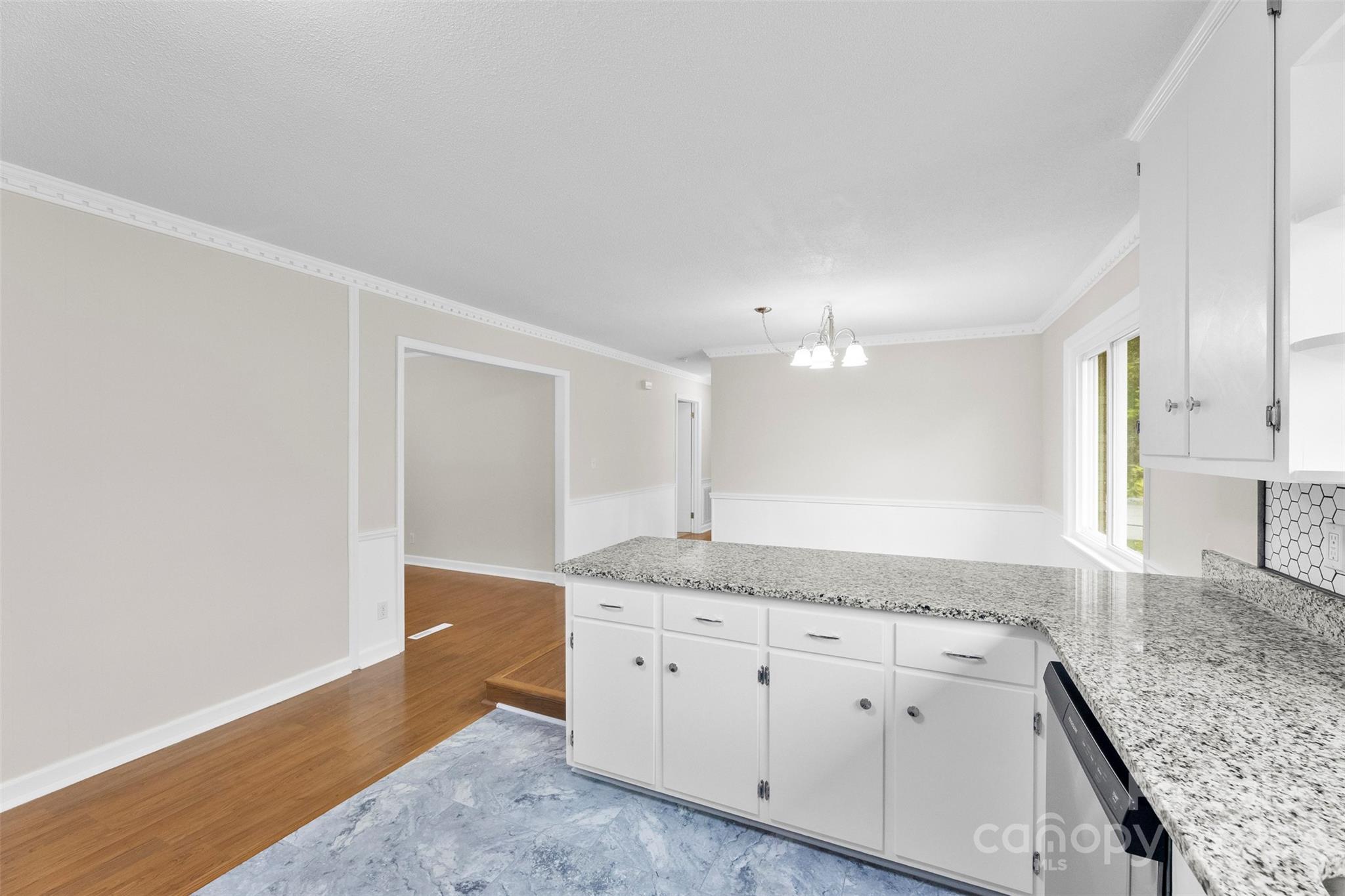 404 Kings Street Cherryville, NC 28021 - Photo 11 of 33 a kitchen with granite countertop white cabinets and a granite counter tops