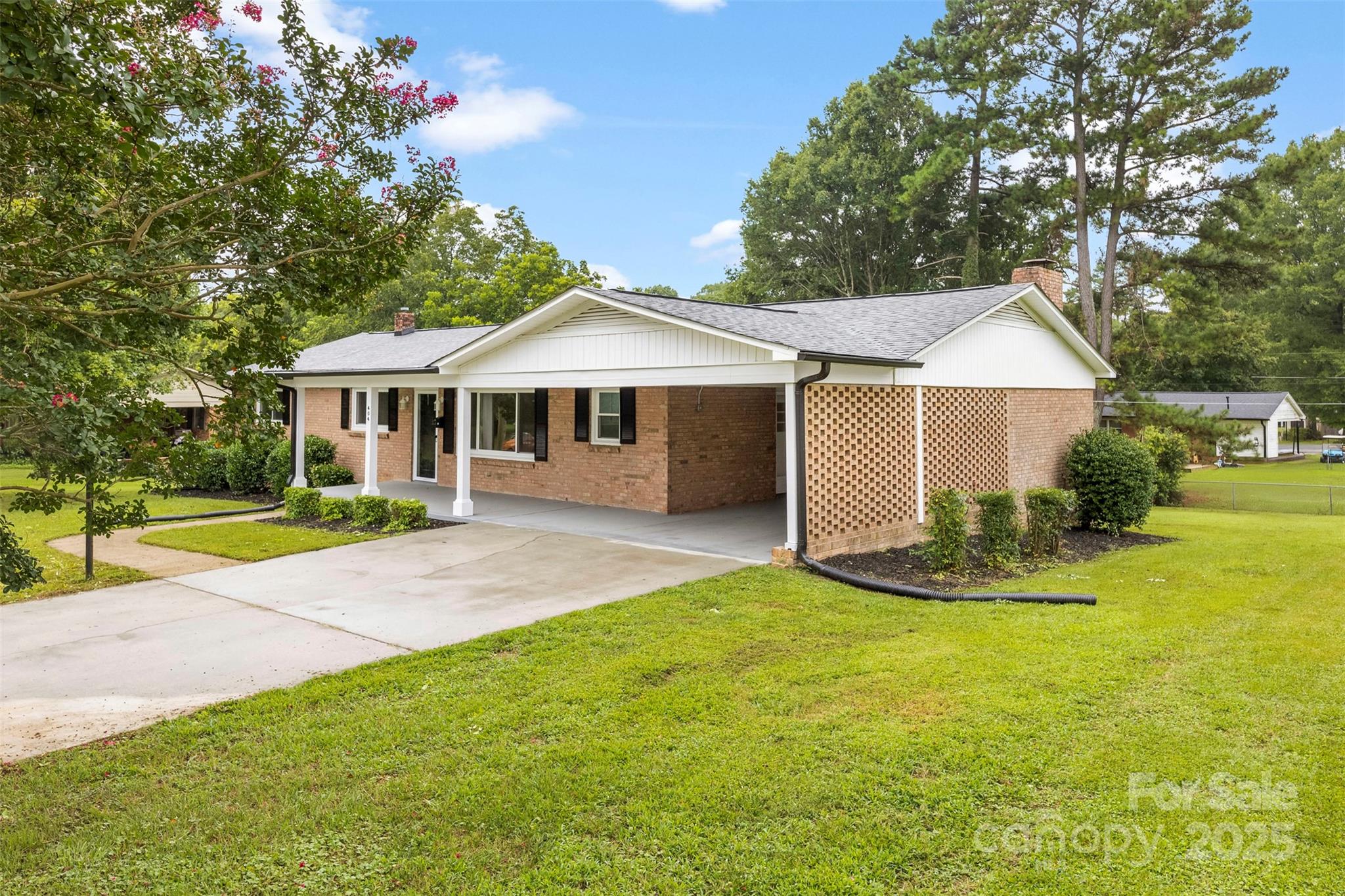 404 Kings Street Cherryville, NC 28021 - Photo 3 of 33 a front view of a house with a yard