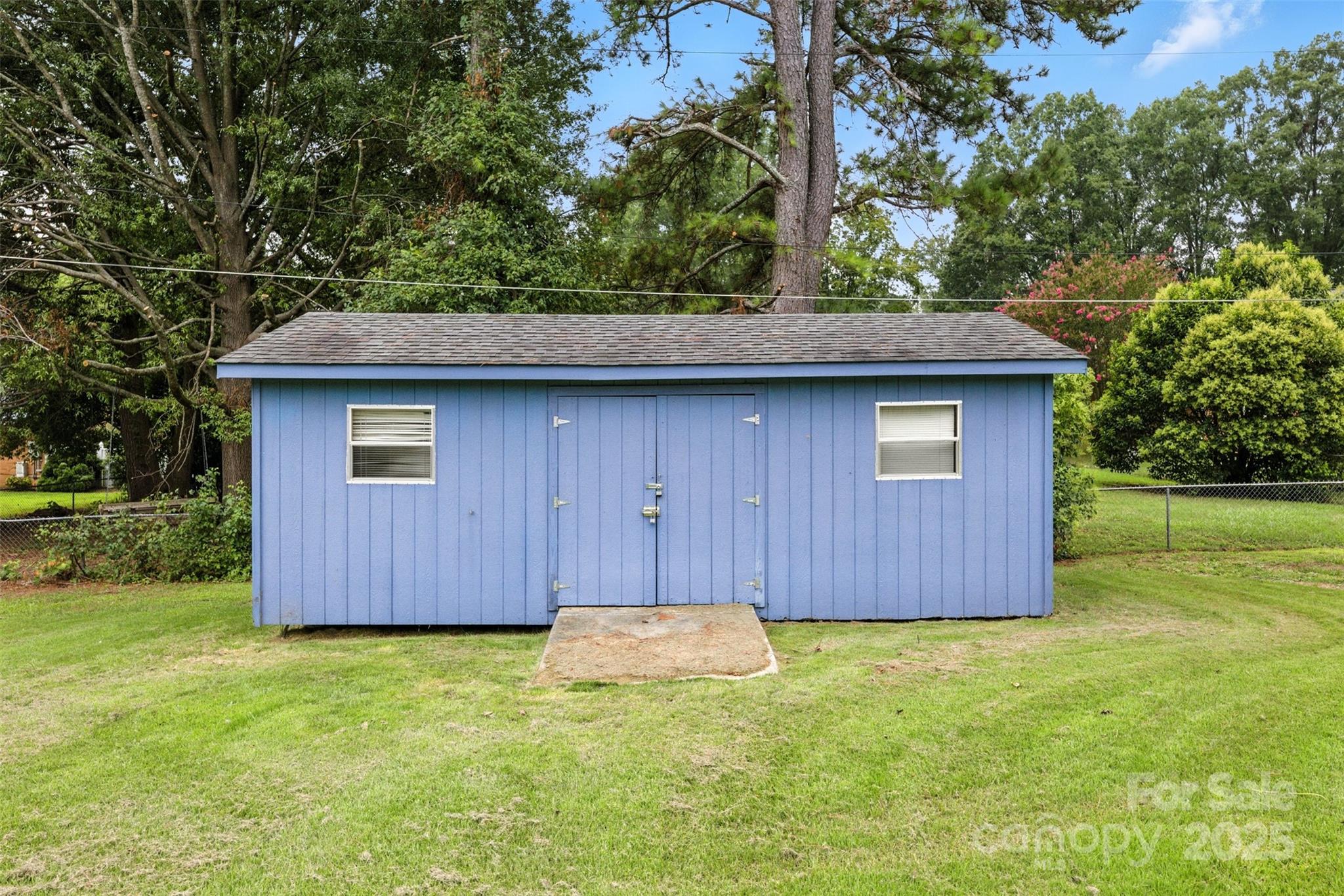 404 Kings Street Cherryville, NC 28021 - Photo 33 of 33 a view of a backyard with a barn and large trees