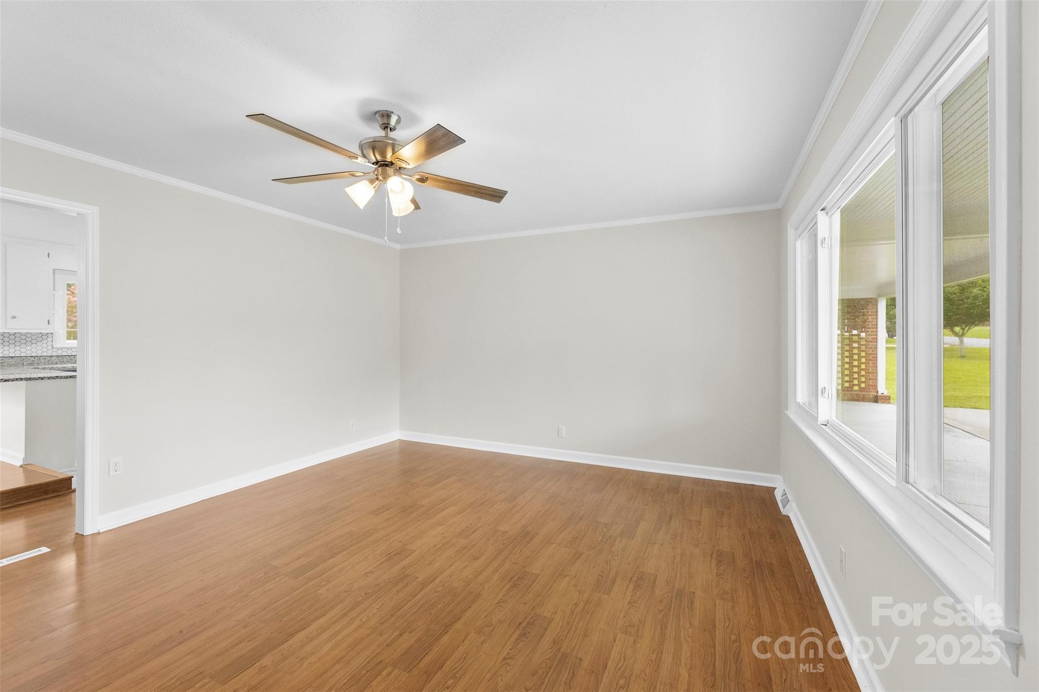 404 Kings Street Cherryville, NC 28021 - Photo 4 of 33 wooden floor in an empty room with a window
