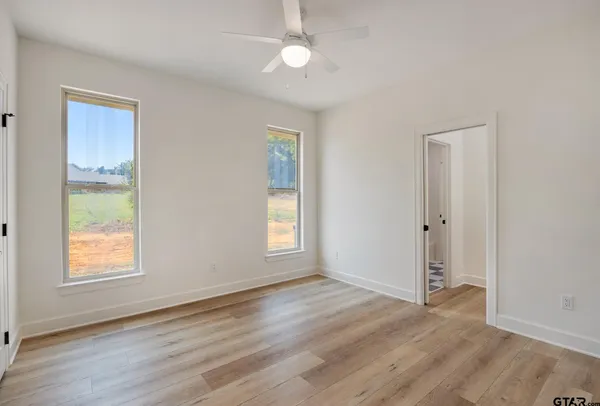 a living room with a fireplace and a wooden floor