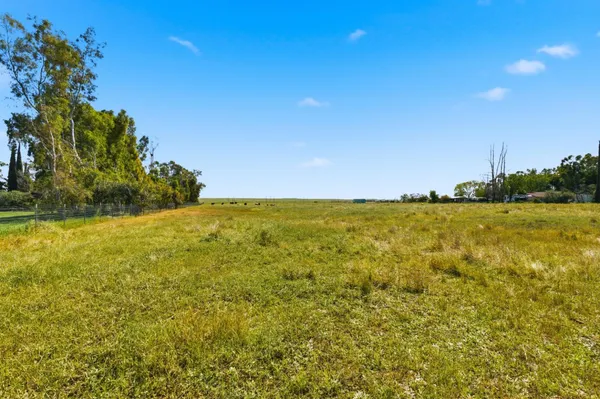 a view of yard with swimming pool and outdoor seating