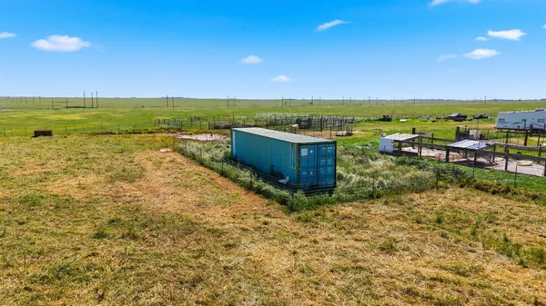 a view of a yard with an ocean view