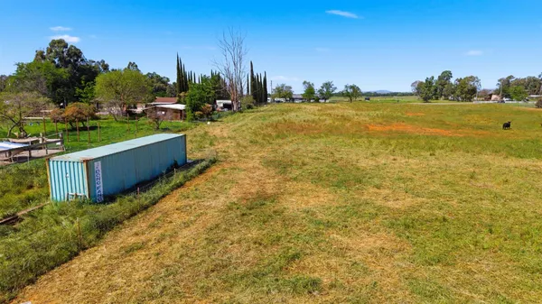 a swimming pool with an outdoor space and seating area