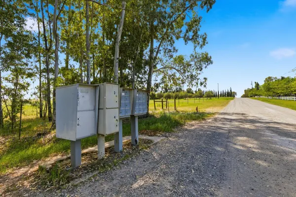 a view of a backyard with swimming pool